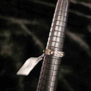 .1CTW VVSD Moissanite wedding ring in .925 Sterling Silver. Size 5